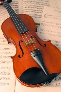 http://www.dreamstime.com/royalty-free-stock-photo-violin-over-music-scores-image8393175